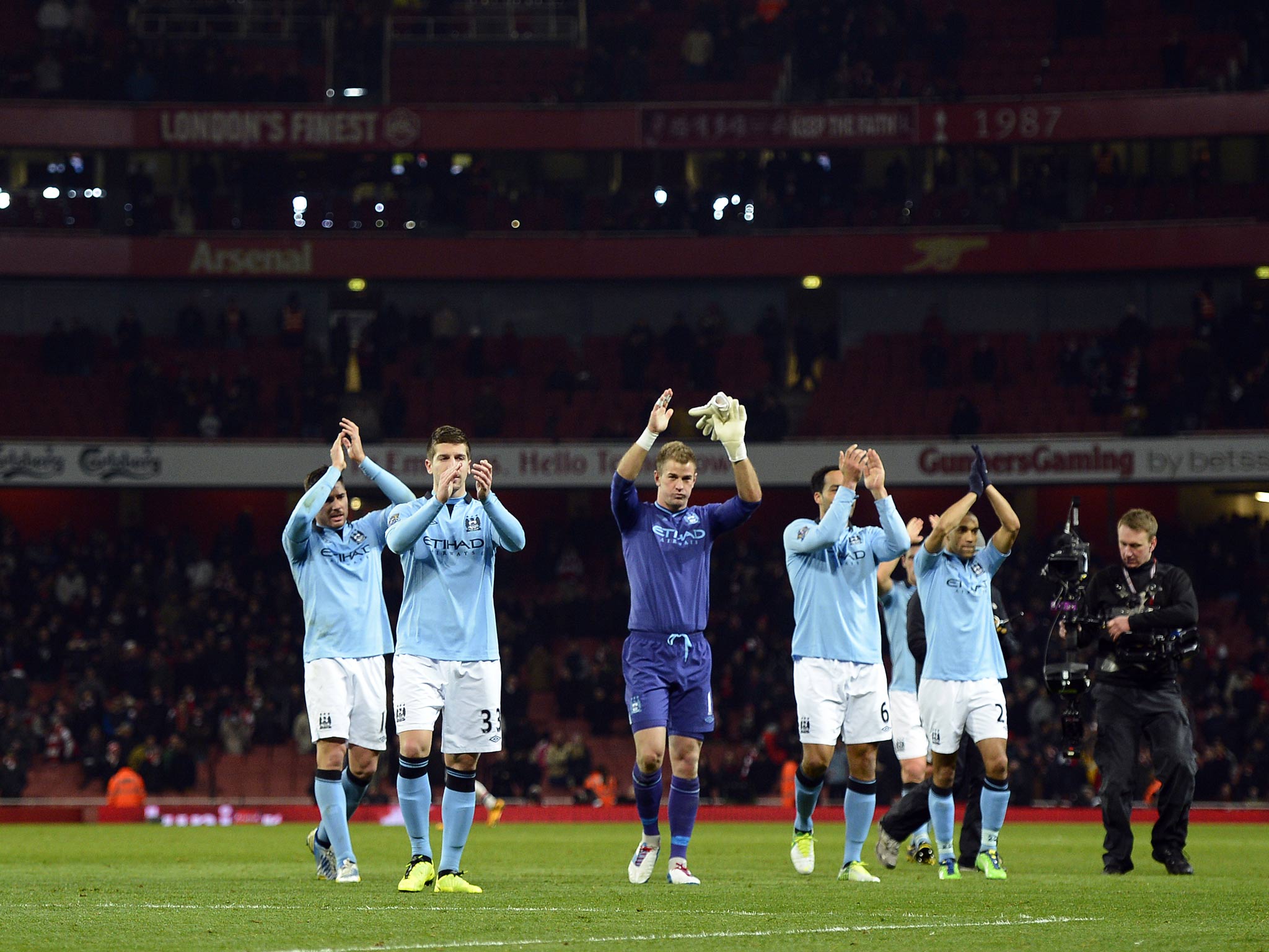 Manchester City players acknowledge their fans at Arsenal
